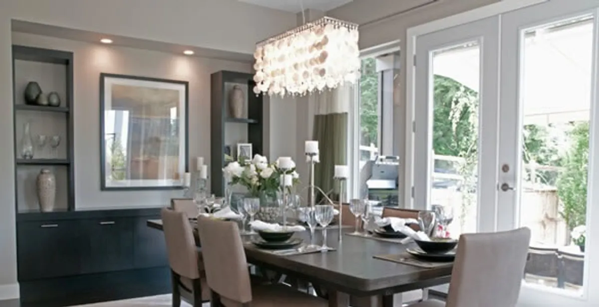 Elegant dining room chandelier installation above table in Harrisburg, PA