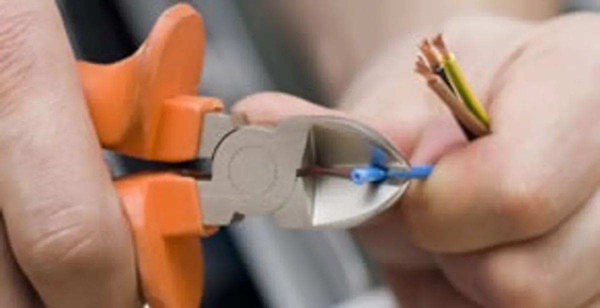 professional electrical services showing precise wire cutting by licensed electricians in Harrisburg, PA
